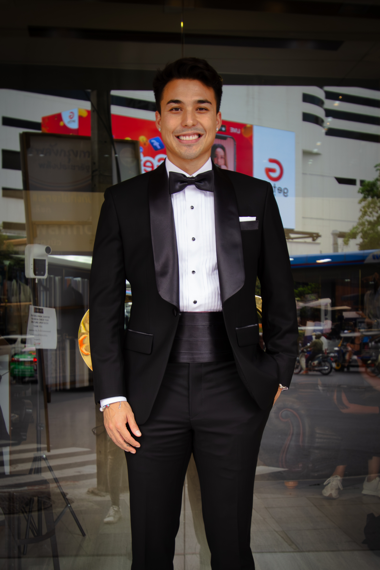 Client in a shawl-lapel tuxedo with cummerbund by Gulati