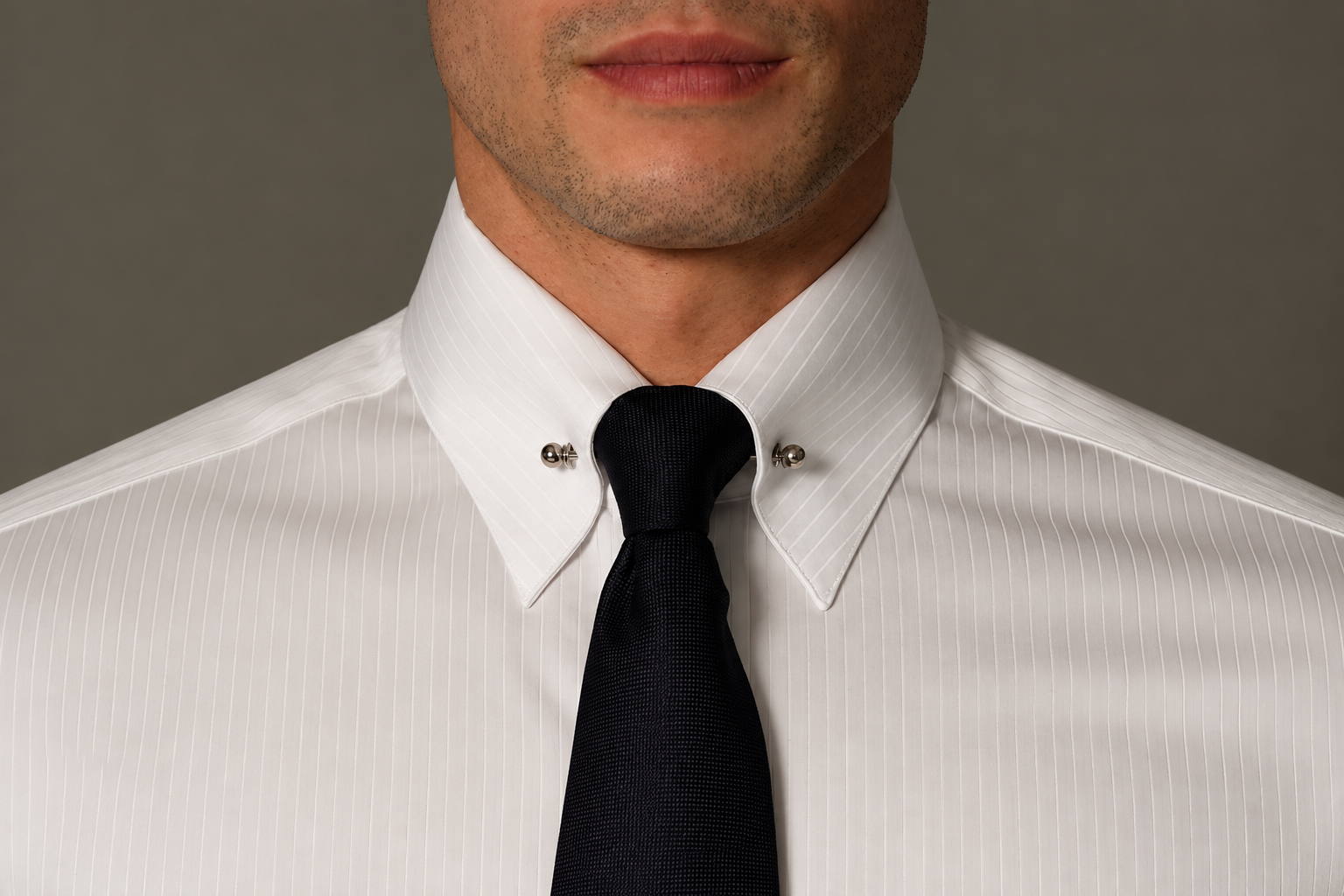 White pinstripe bespoke shirt with a pin collar and black tie